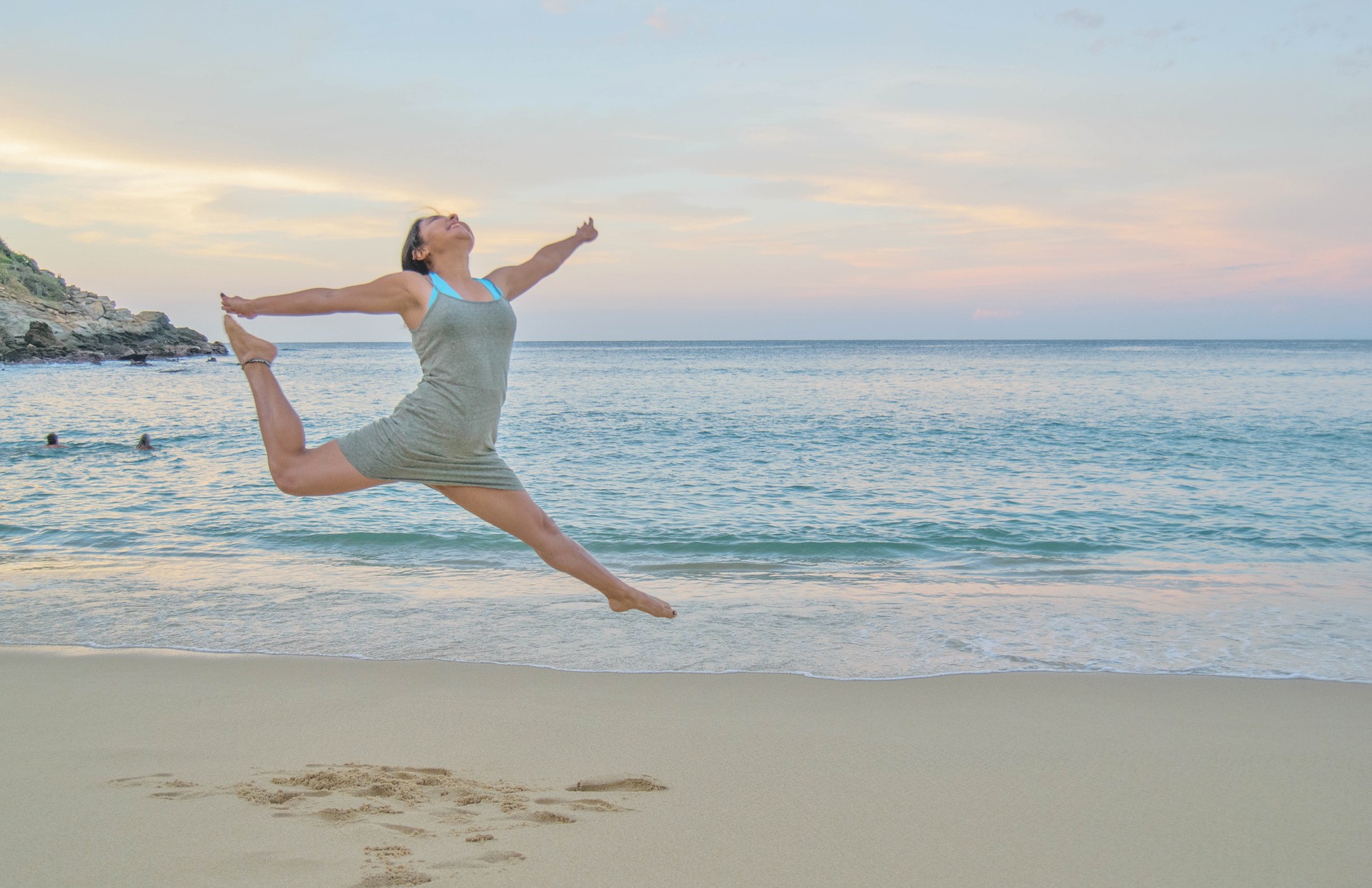 woman dancing on beach